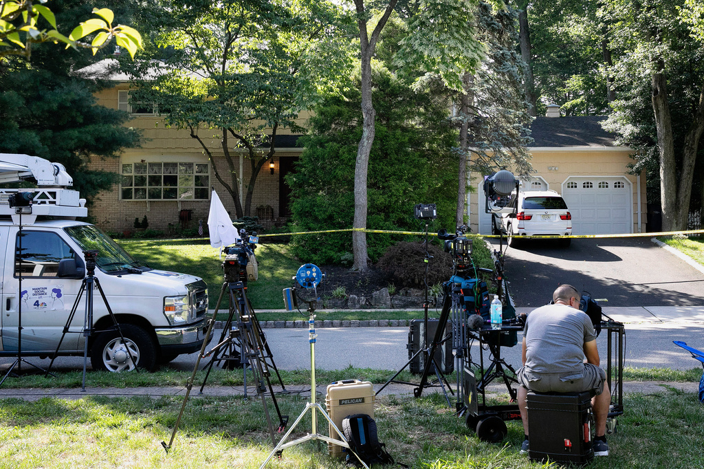 FILE - News media is set up in front of the home of U.S. District Judge Esther Salas in North Brunswick, N.J., on Monday, July 20, 2020, after a gunman posing as a delivery person shot and killed Salas' 20-year-old son and wounded her husband Sunday evening. (AP Photo/Mark Lennihan, File)