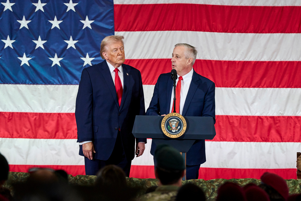 President Donald Trump watches while Republican Senate candidate Michael Whatley speaks to the troops in Fort Bragg, N.C., Friday, Feb. 13, 2026. (AP Photo/Matt Ramey)