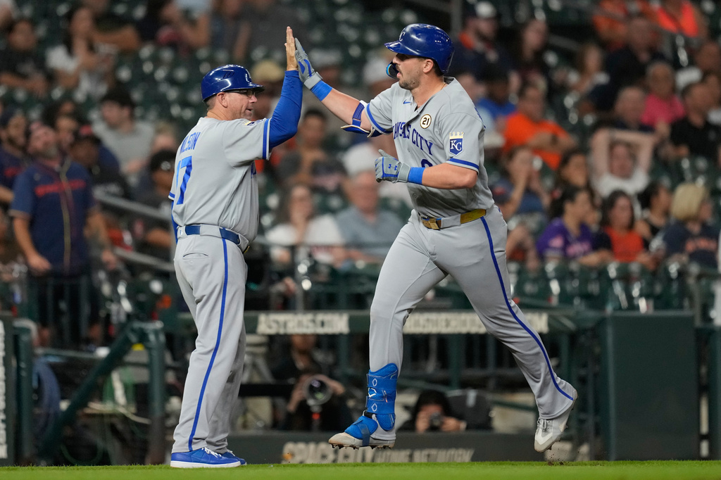 Kansas City Royals' Vinnie Pasquantino (9) celebrates with third base coach Vance Wilson (17) after hitting a home run during the sixth inning of a baseball game against the Houston Astros in Houston, Tuesday, Sept. 15, 2026. (AP Photo/Ashley Landis)