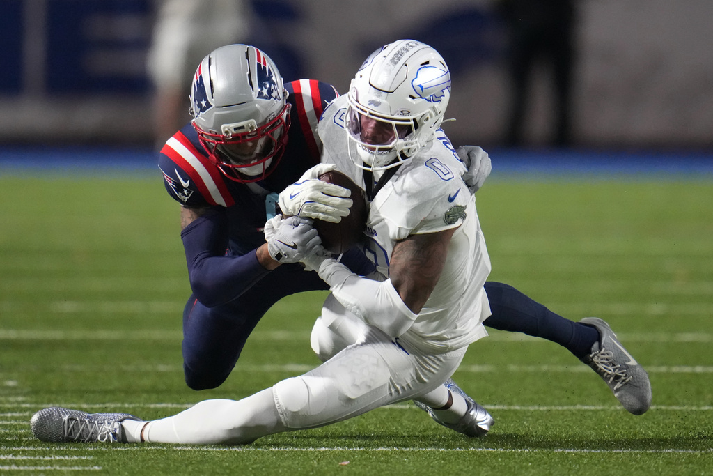 Buffalo Bills wide receiver Keon Coleman (0) is hit by New England Patriots cornerback Carlton Davis III (7) after a catch during the second half of an NFL football game, Sunday, Sept. 5, 2025, in Orchard Park, N.Y. (AP Photo/Gene J. Puskar)