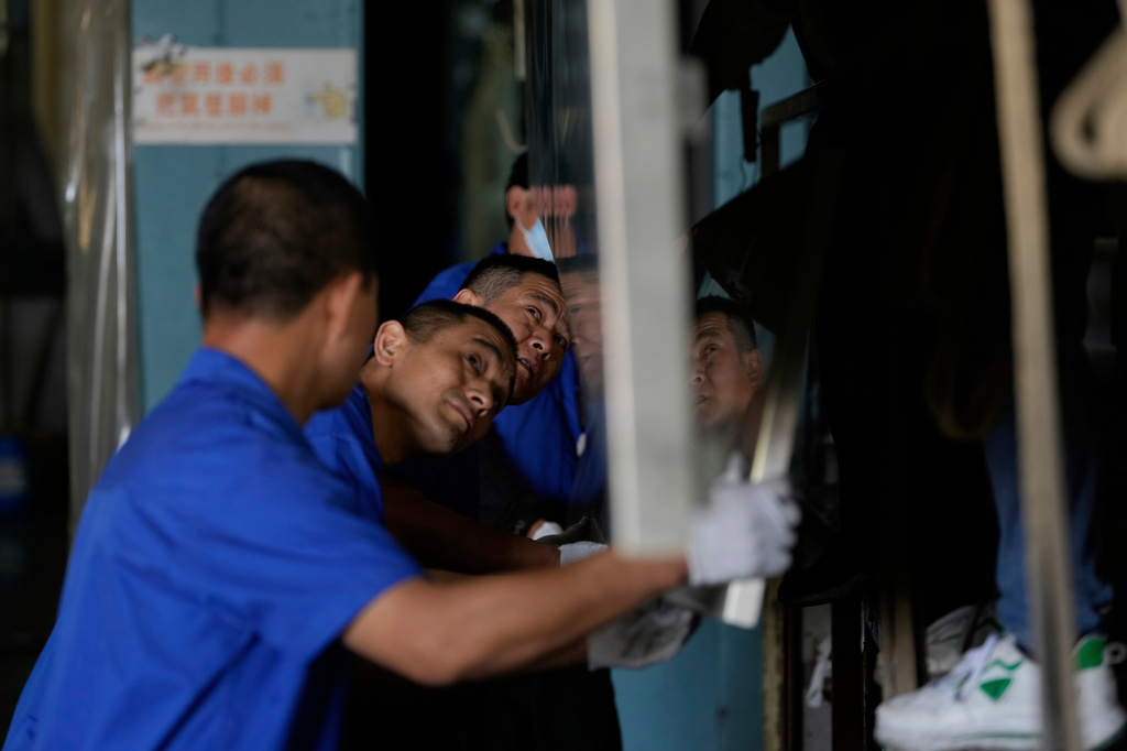 FILE - A worker prepares aluminum panels for coating at a factory of Kam Pin Industrial (HK) Ltd, in Dongguan city in southern China's Guangdong province on Thursday, April 17, 2025. (AP Photo/Ng Han Guan,File)