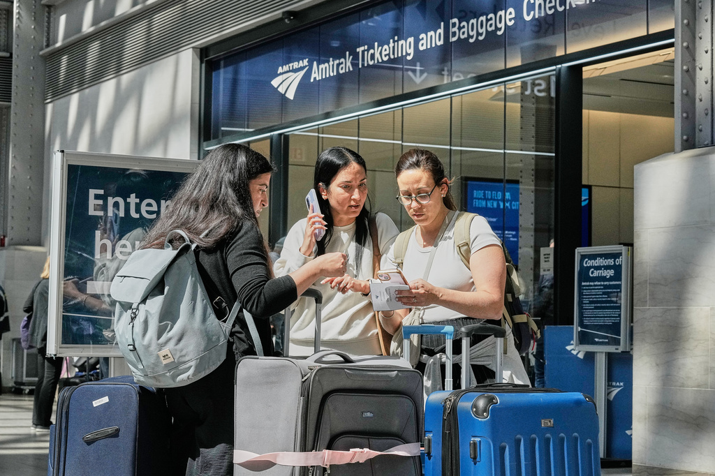Amtrak passengers in New York's Penn Station, Friday, May 29, 2026. (AP Photo/Richard Drew)
