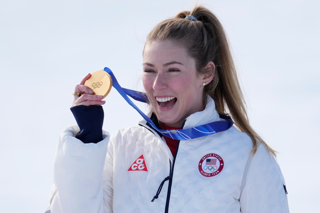 United States' Mikaela Shiffrin shows her gold medal of the alpine ski, women's slalom race, at the 2026 Winter Olympics, in Cortina d'Ampezzo, Italy, Wednesday, Feb. 18, 2026. (AP Photo/Robert F. Bukaty)