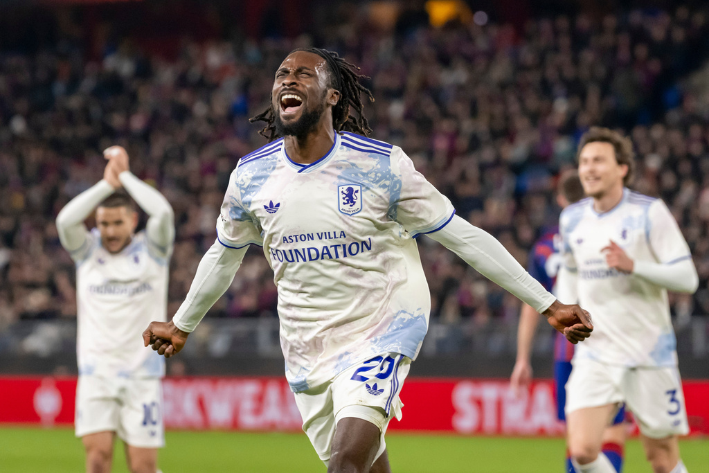 Villa's Eyann Guessand, front, celebrates after scoring the opening goal during the Europa League opening phase soccer match between FC Basel 1893 and Aston Villa in Basel, Switzerland, Thursday, Dec. 11, 2025. (Georgios Kefalas/Keystone via AP)