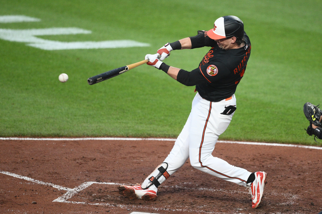 Baltimore Orioles' Adley Rutschman singles in two runs during the third inning of a baseball game, Thursday, June 11, 2026, in Baltimore. (AP Photo/Nick Wass)