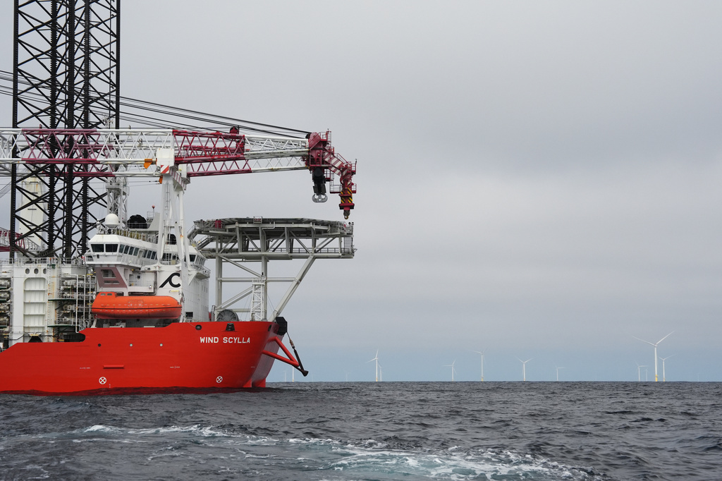 A vessel is visible near Sunrise Wind offshore wind farm that is under construction off the coast of Montauk Point, New York, Thursday, April 23, 2026. (AP Photo/Joshua A. Bickel)