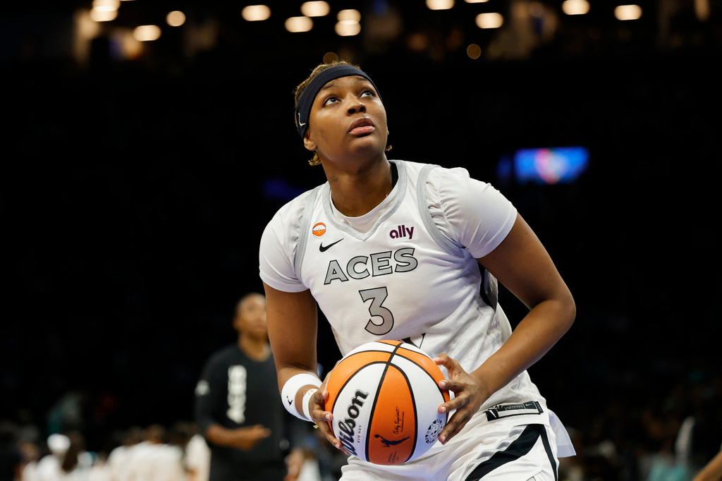 FILE - Las Vegas Aces forward NaLyssa Smith warms up before the second half of a WNBA basketball game against the New York Liberty, Aug. 9, 2026, in New York. (AP Photo/Meagan Leverone, File)