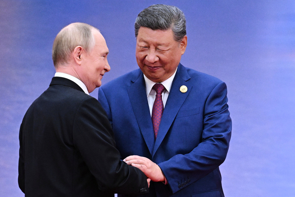 FILE - Russian President Vladimir Putin, left, and Chinese President Xi Jinping greet each other in Tianjin, China, on Aug. 31, 2025. (Sergei Bobylev, Sputnik, Kremlin Pool Photo via AP, File)