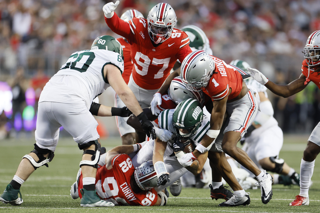 Ohio State defenders stop Ohio tight end Mason Williams during the first half of an NCAA college football game, Saturday, Sept. 13, 2025, in Columbus, Ohio. (AP Photo/Jay LaPrete)