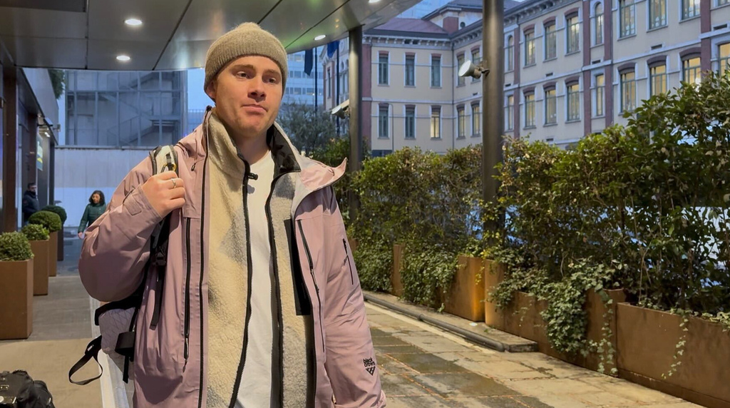 Norwegian skier Nikolai Schirmer walks out of a Milan hotel, Wednesday, Feb. 4, 2026, after privately meeting with the IOC's head of sustainability, Julie Duffus, to hand her a “ski fossil free” petition with over 20,000 signatures two days before the Opening Ceremony for the 2026 Milan Cortina Winter Olympics. (AP Photo/Fernanda Figueroa)