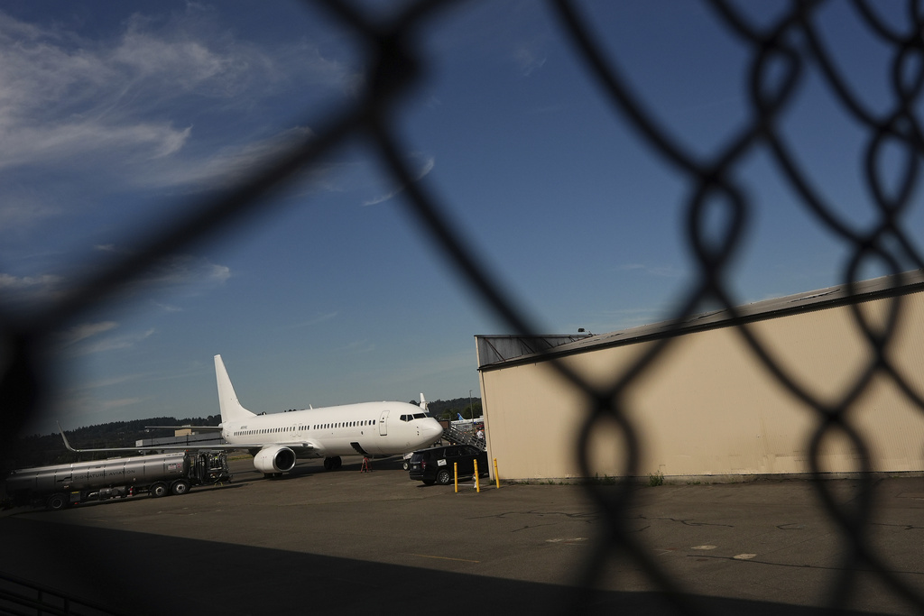 A U.S. Immigration and Customs Enforcement flight operates out of King County International Airport-Boeing Field, Saturday, Aug. 23, 2025, in Seattle. (AP Photo/Lindsey Wasson)