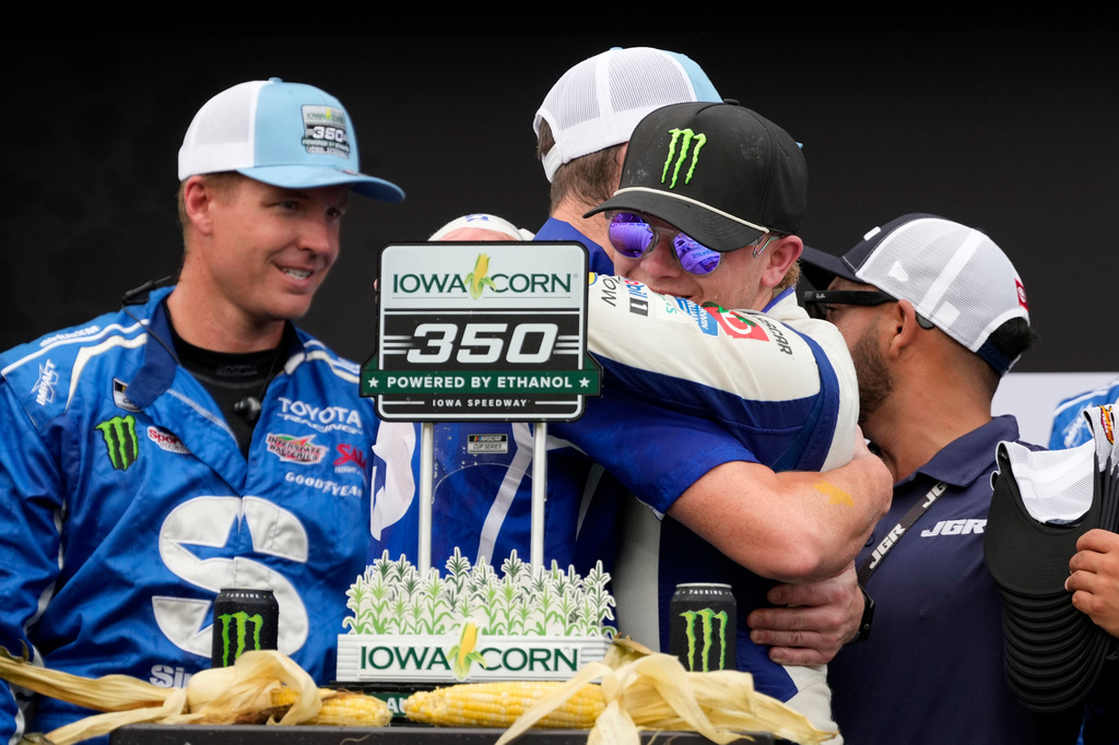 Ty Gibbs celebrates with crew members after winning a NASCAR Cup Series auto race, Sunday, Aug. 9, 2026, at Iowa Speedway in Newton, Iowa. (AP Photo/Charlie Neibergall)