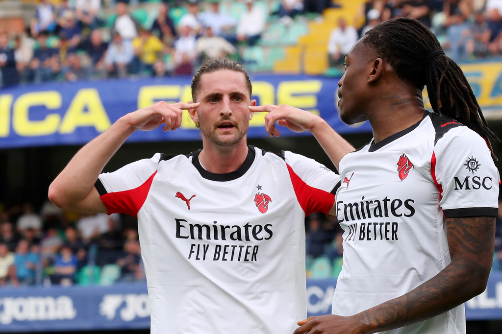 AC Milan's Adrien Rabiot, left, celebrates scoring during the Serie A soccer match between Hellas Verona and A.C. Milan in Verona, Italy, Sunday April 19, 2026. (Paola Garbuio/LaPresse via AP)