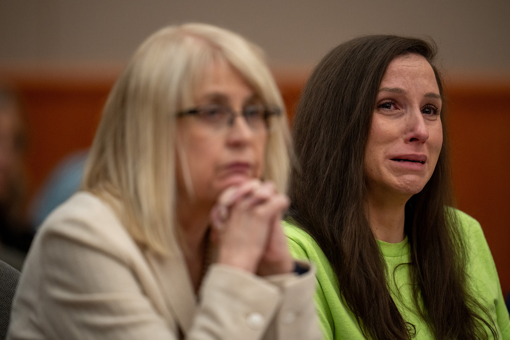 Kouri Richins, right, reacts as her brother, Ronney Darden, speaks on her behalf during her sentencing in 3rd District Court in Park City, Utah, Wednesday, May 13, 2026. (Trent Nelson/The Salt Lake Tribune via AP, Pool)