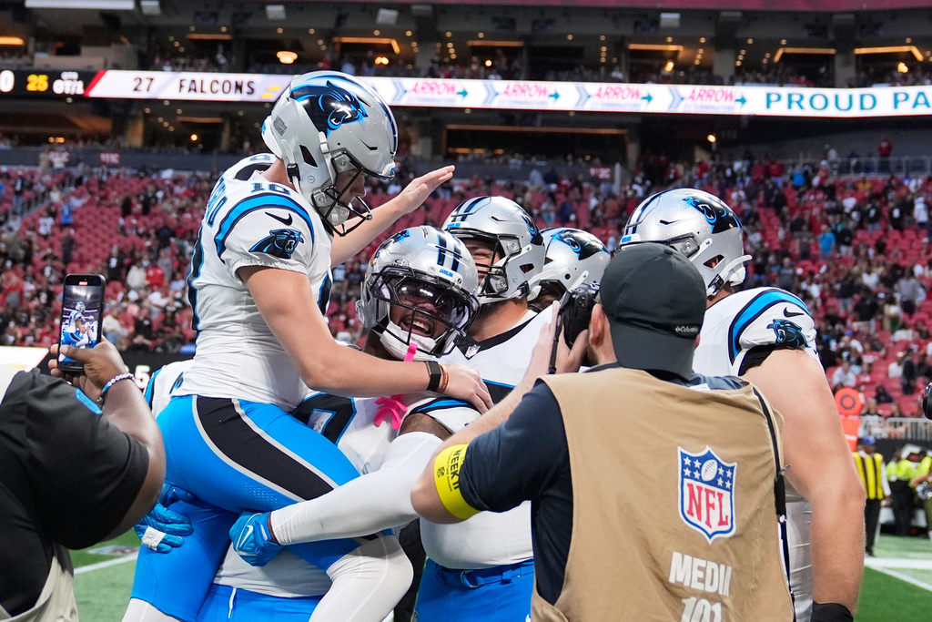 Carolina Panthers place kicker Ryan Fitzgerald (10) celebrates his game wining field goal during overtime of an NFL football game against the Atlanta Falcons, Sunday, Nov. 16, 2025, in Atlanta. (AP Photo/Brynn Anderson)