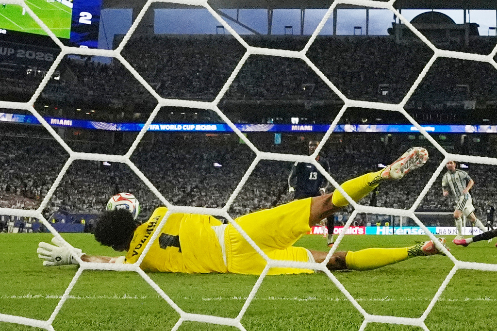 Cape Verde goalkeeper Vozinha (1) makes a save on a shot by Argentina's Lionel Messi (10) during the first half of extra time in the World Cup round of 32 soccer match between Argentina and Cape Verde in Miami Gardens, Fla., Friday, July 3, 2026. (AP Photo/Lynne Sladky)