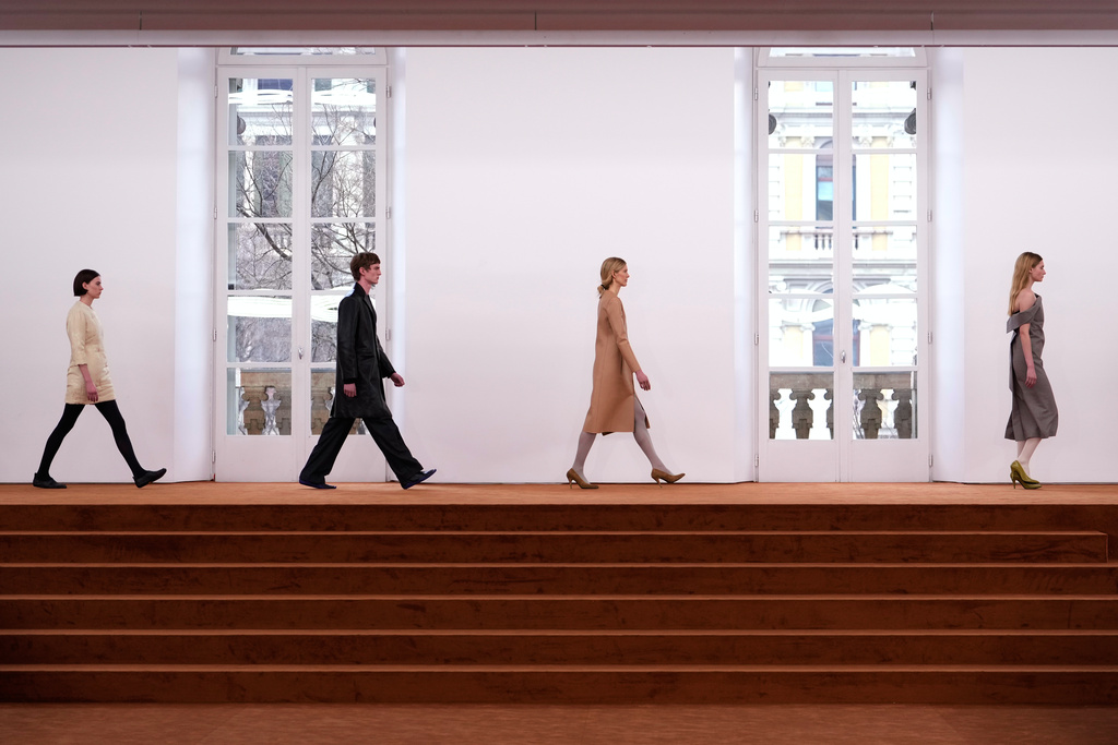 Models wear creations from the Jil Sander Fall/Winter 2026-2027 Women's collection presented in Milan, Italy, Wednesday, Feb. 25, 2026. (AP Photo/Luca Bruno)