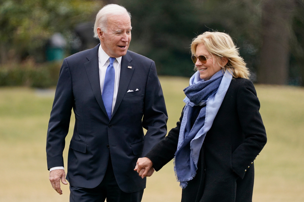 FILE - President Joe Biden and first lady Jill Biden arrive on the South Lawn of the White House, Jan. 23, 2023, in Washington. (AP Photo/Evan Vucci, File)