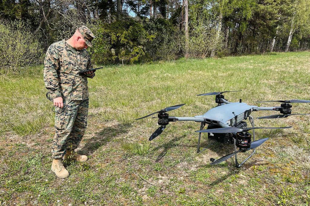 A U.S marine serviceman stands next to a TRV 150 drone during a military exercises in Gotland, Sweden, Monday, May 11, 2026. (AP Photo/Emma Burrows)