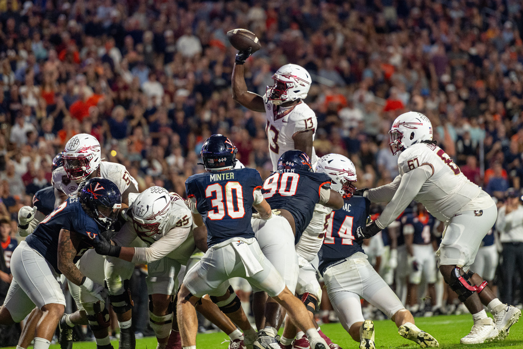 Florida State tight end Randy Pittman Jr. (13) throws for a touchdown during the second half of an NCAA college football game, Friday, Sept. 26 2025, in Charlottesville, Va. (AP Photo/Robert Simmons)