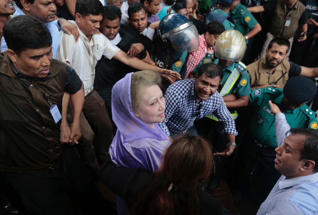 FILE - Bangladesh's former prime minister and Bangladesh Nationalist Party leader Khaleda Zia, center, leaves court after a hearing in Dhaka, Bangladesh, Aug. 10, 2016. (AP Photo, File)