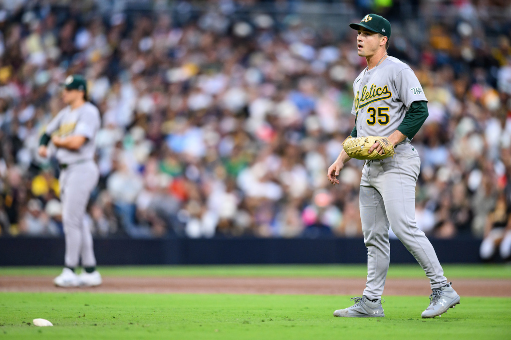 Athletics pitcher J.T. Ginn (35) looks on after giving up three walks in a row during the second inning of a baseball game against the San Diego Padres, Saturday, May 23, 2026, in San Diego. (AP Photo/William Liang)