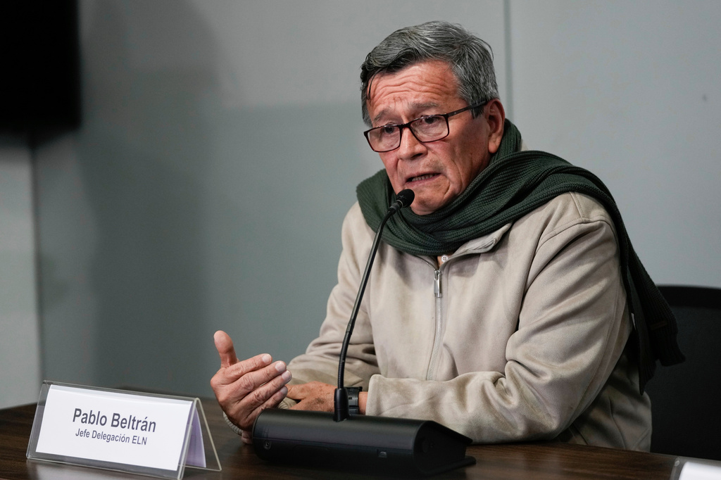 FILE - Pablo Beltrán, commander and chief negotiator for the National Liberation Army, ELN, rebel group speaks during a joint news conference with Jose Otty Patiño, chief negotiator for the Colombian government, as a part of the peace talks between both parties in Bogota, Colombia, Oct. 10, 2023. (AP Photo/Fernando Vergara, File)