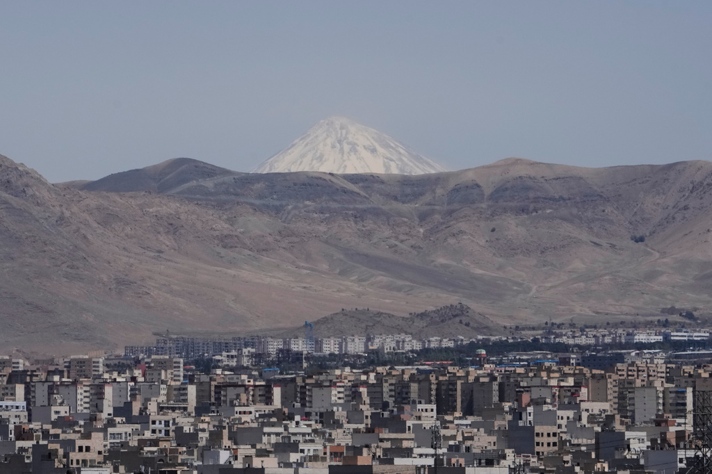 Damavand Peak, the highest peak in Iran, is seen overlooking southeastern Tehran, Tuesday, April 14, 2026. (AP Photo/Vahid Salemi)