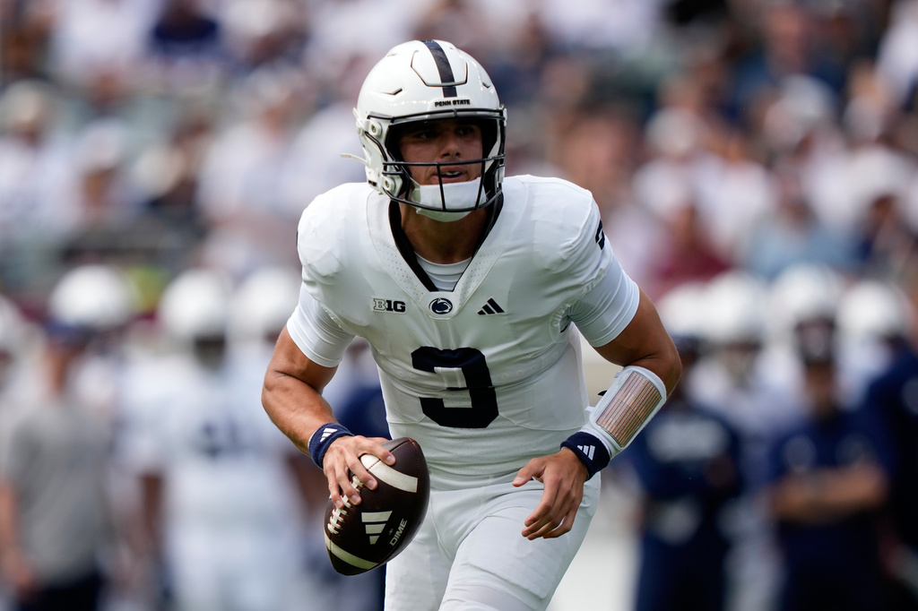 Penn State's Rocco Becht scrambles during the first half of an NCAA college football game against Temple Saturday, Sept. 12, 2026, in Philadelphia. (AP Photo/Matt Slocum)