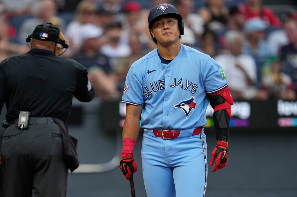 Toronto Blue Jays' Kazuma Okamoto walks back to the dugout after striking out in the second inning of a baseball game against the Cleveland Guardians in Cleveland, Tuesday, Sept. 1, 2026. (AP Photo/Sue Ogrocki)