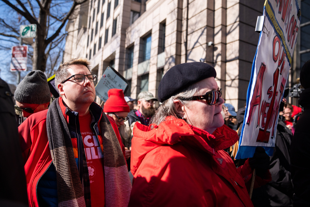 Protesters outside of the Washington Post office demonstrate following a mass layoff, Thursday, Feb. 5, 2026, in Washington. (AP Photo/Allison Robbert)