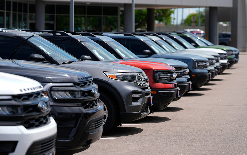 FILE - A line of unsold 2024 utility vehicles sit at a Ford dealership Sunday, May 19, 2024, in Denver. (AP Photo/David Zalubowski, File)