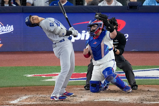 Los Angeles Dodgers' Shohei Ohtani leans away from an inside pitch as Toronto Blue Jays' Alejandro Kirk makes the catch during the seventh inning in Game 1 of baseball's World Series, Friday, Oct. 24, 2025, in Toronto. (AP Photo/David J. Phillip) Los Angeles Dodgers' Shohei Ohtani leans away from an inside pitch as Toronto Blue Jays' Alejandro Kirk makes the catch during the seventh inning in Game 1 of baseball's World Series, Friday, Oct. 24, 2025, in Toronto. (AP Photo/David J. Phillip)