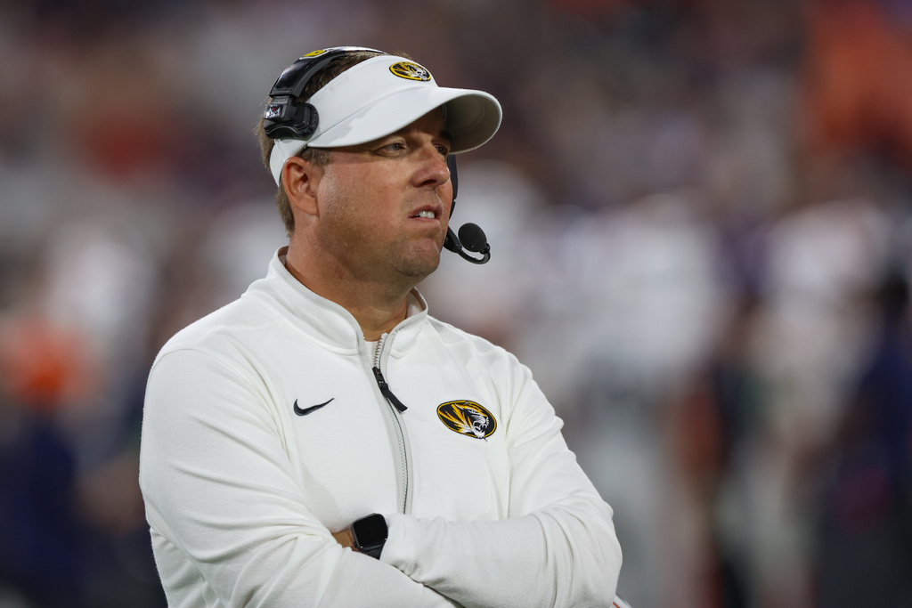 Missouri head coach Eliah Drinkwitz walks the sideline against Virginia during the second quarter of a Gator Bowl NCAA college football game in Jacksonville, Fla., Saturday, Dec. 27, 2025. (AP Photo/Gary McCullough)