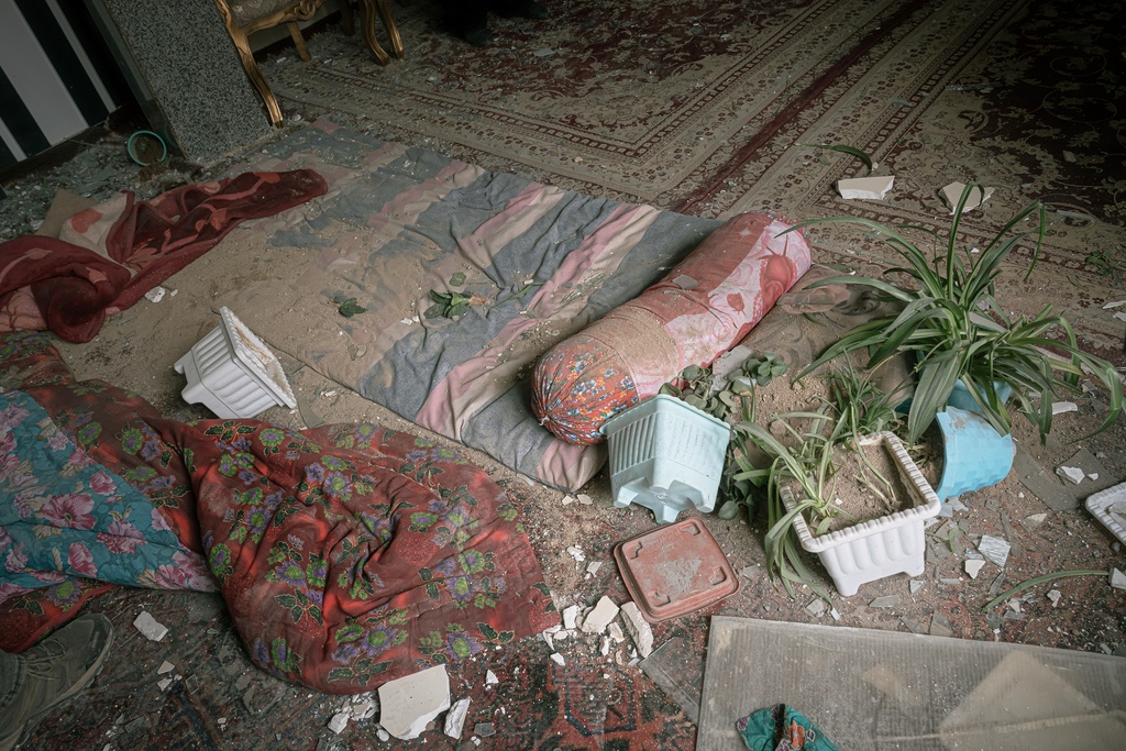 A damaged room is seen in a house that was affected when a nearby residential building was hit in an overnight strike during the U.S.-Israeli military campaign in Tabriz, East Azerbaijan Province, northwestern Iran, Tuesday, March 24, 2026. (AP Photo/Matin Hashemi)