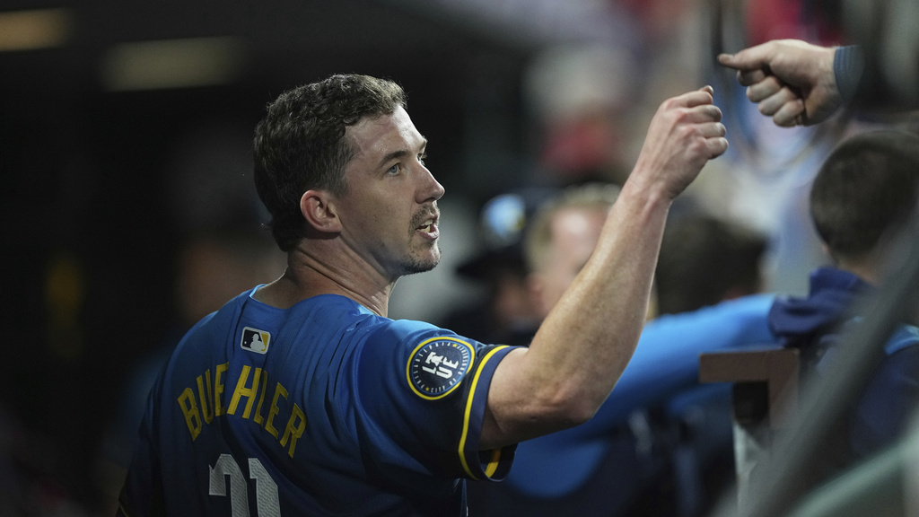 Philadelphia Phillies pitcher Walker Buehler fist bumps Brandon Marsh during the fourth inning of a baseball game against the Kansas City Royals, Friday, Sept. 12, 2025, in Philadelphia. (AP Photo/Matt Rourke)