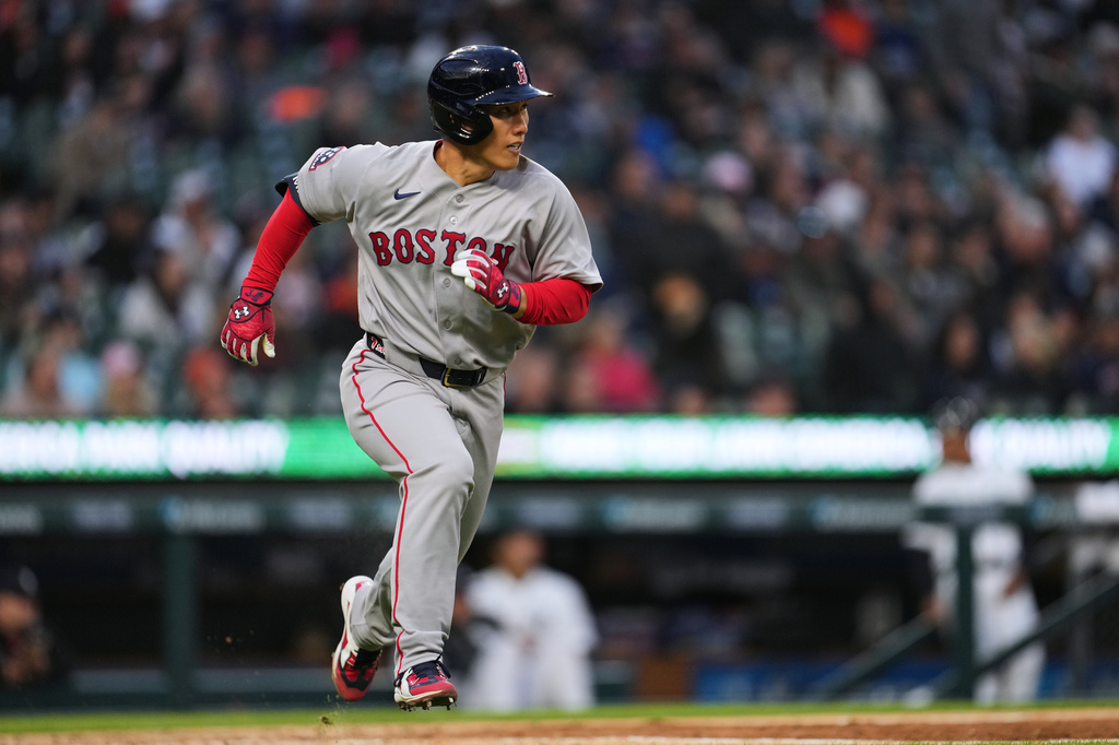 Boston Red Sox's Masataka Yoshida runs out a single against the Detroit Tigers during the sixth inning of a baseball game Wednesday, May 6, 2026, in Detroit. (AP Photo/Paul Sancya)