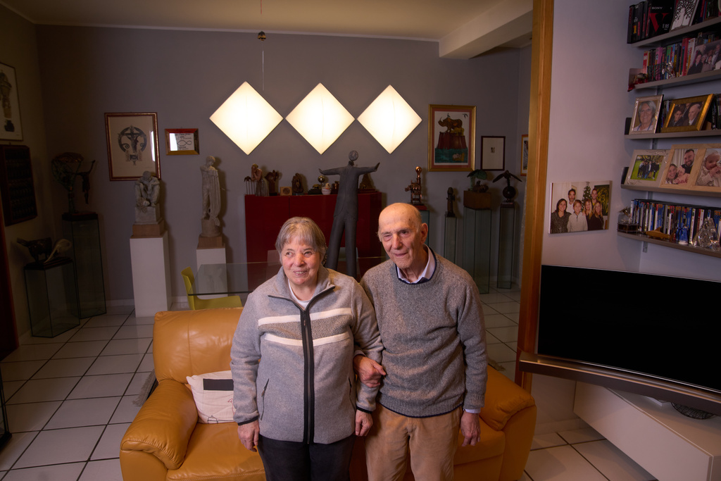 Aldo Grassini and Daniela Bottegoni, both blind, who founded in 1993 the Omero Tactile Museum, the first publicly funded tactile museum in Italy, pose for a portrait in their home in Ancona, Italy, Thursday, Jan. 15, 2026. (AP Photo/Alessandra Tarantino)