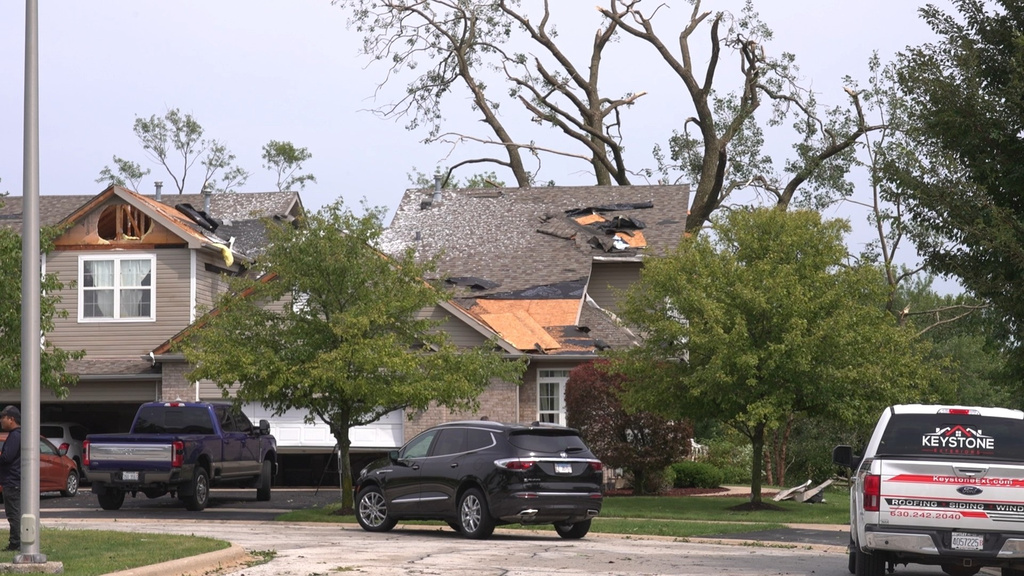 In this image made from video, a roof is damaged after a strong storm in Tinley Park, Ill., Tuesday, Aug. 11, 2026. (AP Photo/Laura Bargfeld)