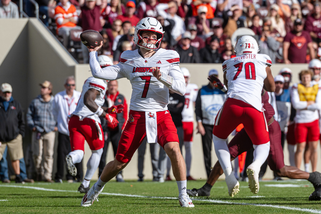Louisville quarterback Miller Moss (7) throws a pass to the sidelines against Virginia Tech during the first half of an NCAA college football game, Saturday, Nov. 1, 2025, in Blacksburg, Va. (AP Photo/Robert Simmons)