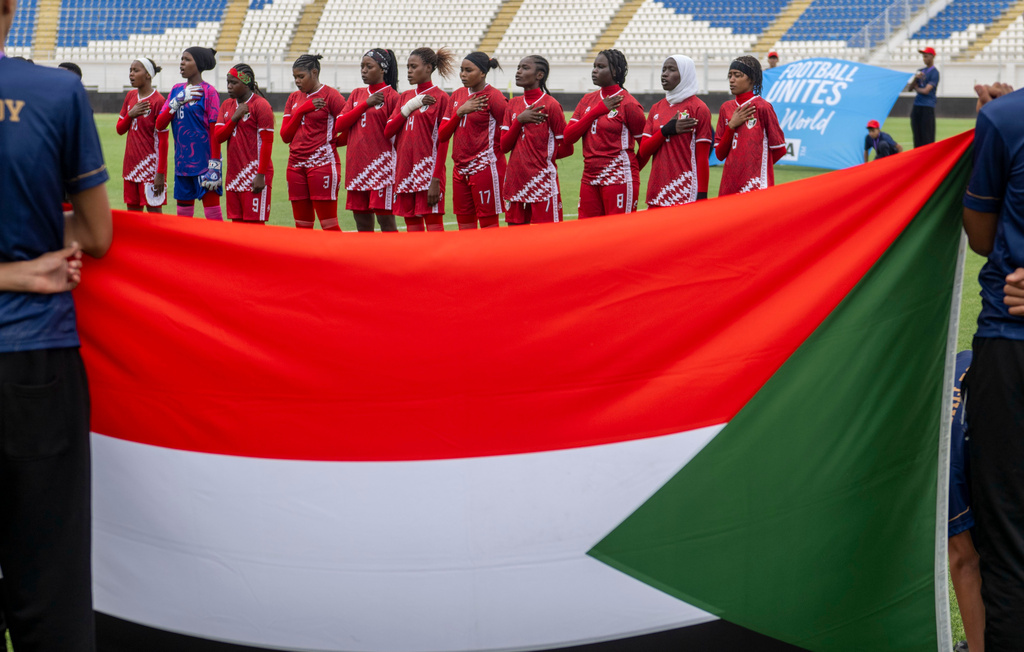 Sudan's U-17 women's national team players sing the national anthem before a soccer match against Comoros, during qualifiers for the 2028 Los Angeles Summer Olympics, in Casablanca, Morocco, Monday, June 8, 2026. (AP Photo)