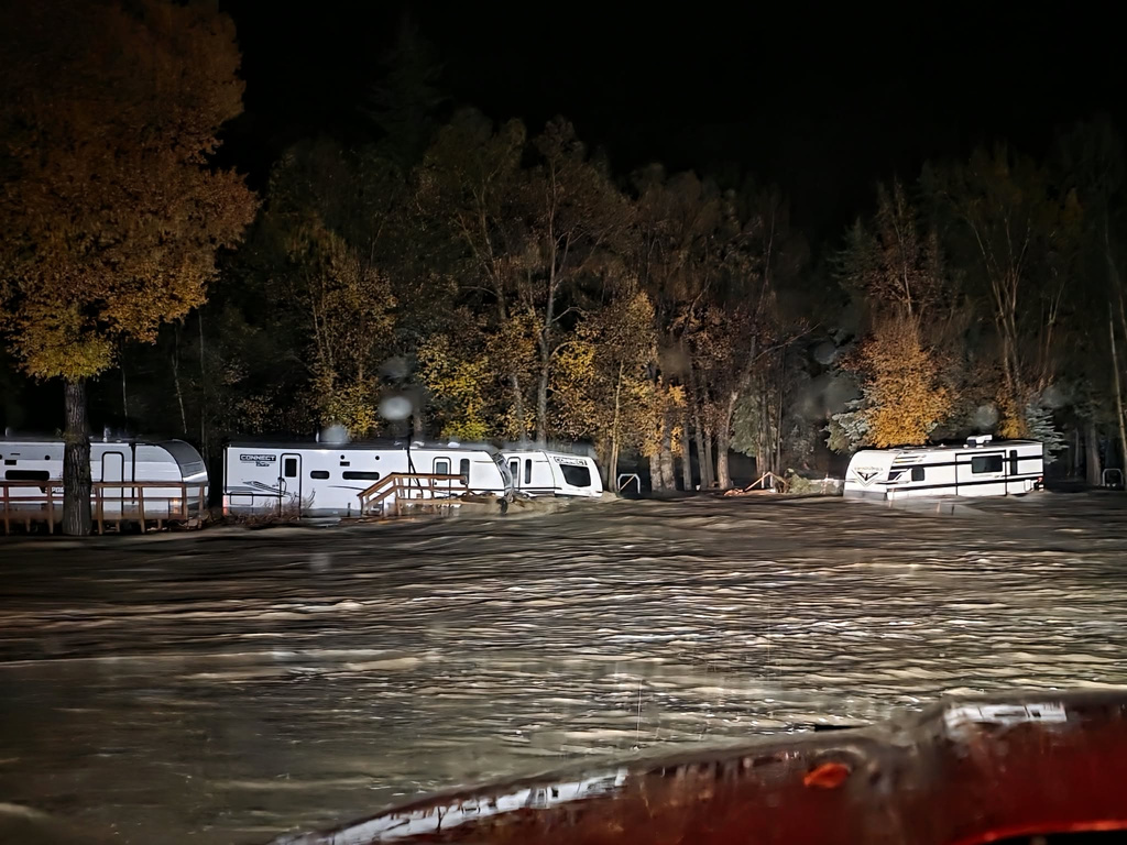Floodwaters surround trailers at the Fun Valley Family Resort campground and RV part in South Fork, Colo., early Friday, Oct. 23, 2026. (South Fork Fire Rescue via AP)