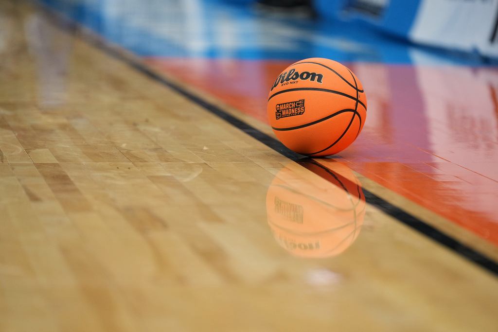 A ball sits on the court during a timeout in the first half in the second round of the NCAA college basketball tournament game between Iowa State and Kentucky, Sunday, March 22, 2026, in St. Louis. (AP Photo/Jeff Roberson)