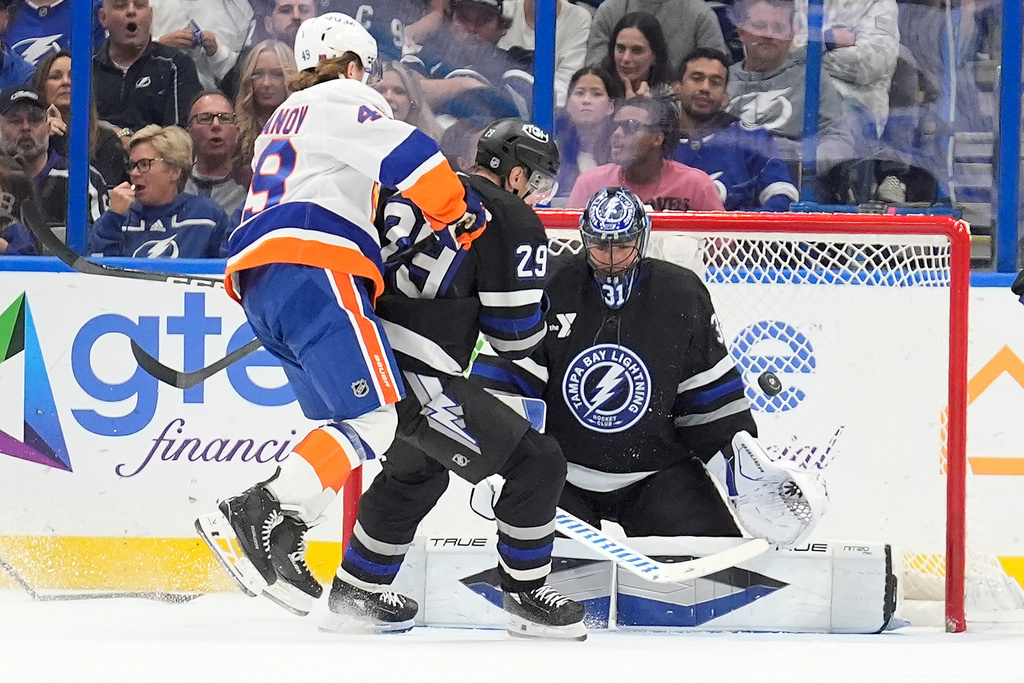 Tampa Bay Lightning goaltender Jonas Johansson (31) makes a save on a shot by New York Islanders right wing Max Shabanov (49) during the second period of an NHL hockey game Saturday, Dec. 6, 2025, in Tampa, Fla. (AP Photo/Chris O'Meara)