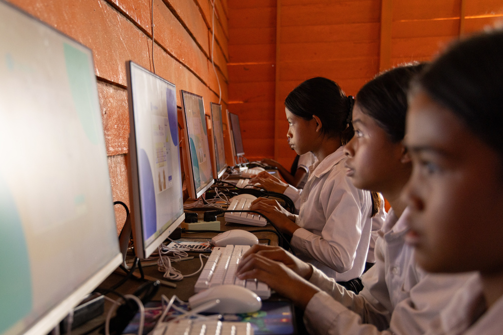 Students attend a computer class at a school in one of the floating villages of Cambodia's Tonle Sap Lake on Monday, June 29, 2026. (AP Photo/Anton L. Delgado)