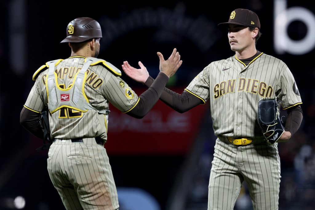 San Diego Padres pitcher Ron Marinaccio, right, celebrates with catcher Luis Campusano (12) after the team's victory over the San Francisco Giants in a baseball game in San Francisco, Tuesday, May 5, 2026. (AP Photo/Jed Jacobsohn)
