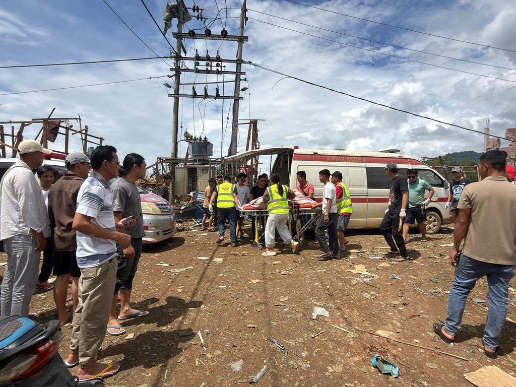 This photo provided by Ta'ang women organization shows rescue work after an explosion in Kaungtup village, Namhkam township, Shan State, Myanmar, Sunday, May 31, 2026. (Ta'ang women organization via AP)