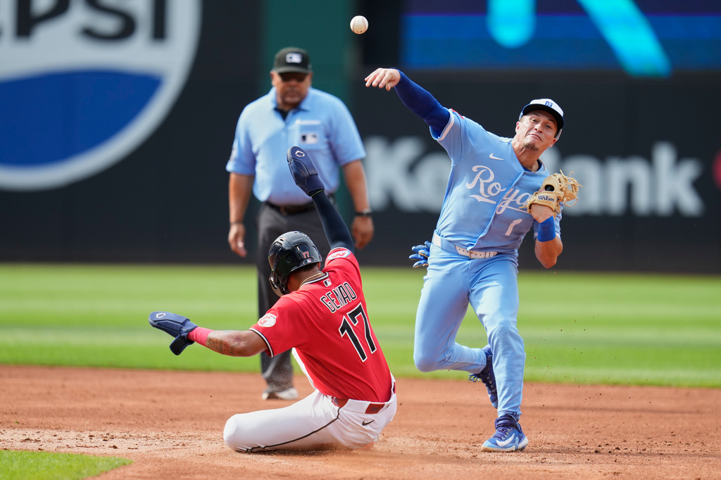 Kansas City Royals' Isaac Collins (1) forces out Cleveland Guardians' Angel Genao (17) at second base and completes the throw to first base for the out on Austin Hedges on a double play ball in the second inning of a baseball game in Cleveland, Saturday, Aug. 29, 2026. (AP Photo/Sue Ogrocki)