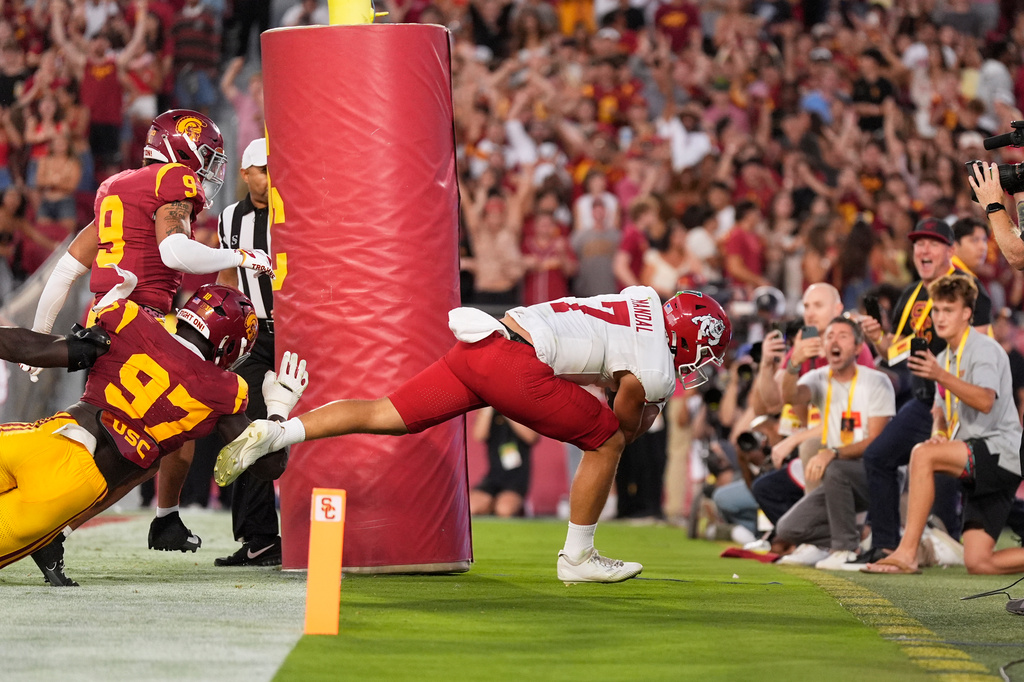 Fresno State quarterback Jayden Mandal, right, his pushed out of the end zone by Southern California defensive tackle Jide Abasiri, lower left, and safety Kennedy Urlacher for a safety during the first half of an NCAA college football game, Friday, Sept. 4, 2026, in Los Angeles. (AP Photo/Mark J. Terrill)