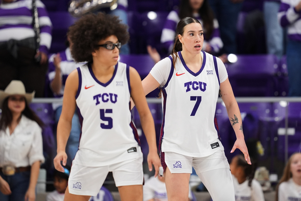 TCU's Olivia Miles (5) and Marta Suarez (7) defend during an NCAA college basketball game against Arkansas Pine Bluff in Fort Worth, Texas, Tuesday, Dec. 16, 2025. (AP Photo/Tony Gutierrez)